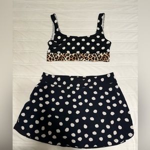 Adorable Pink Ultimate patterned bra and skirt set. Size Small.